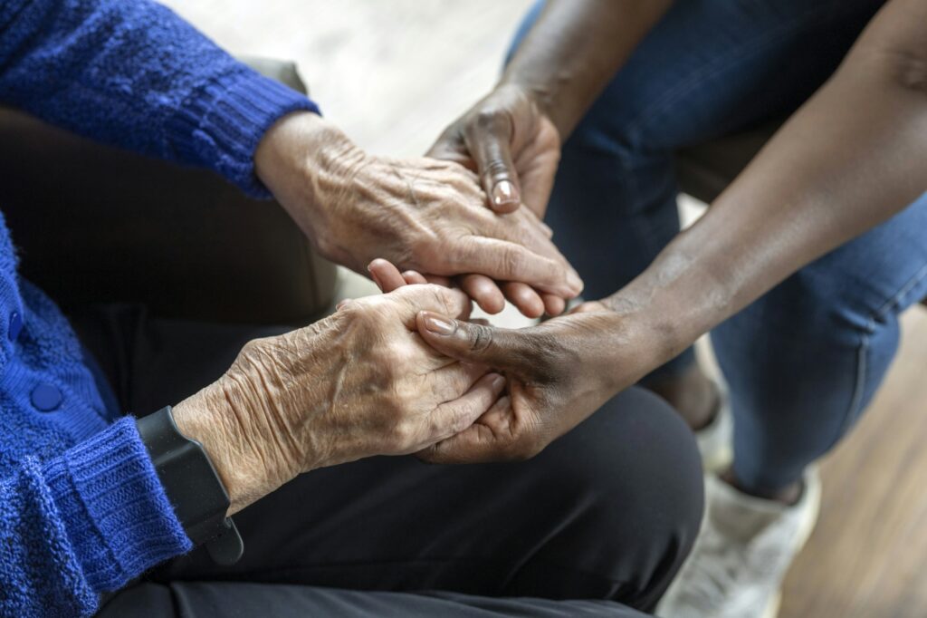 Helper caring for elderly lady